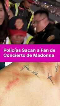 FOTO: Policías Sacan a Fan de Concierto de Madonna